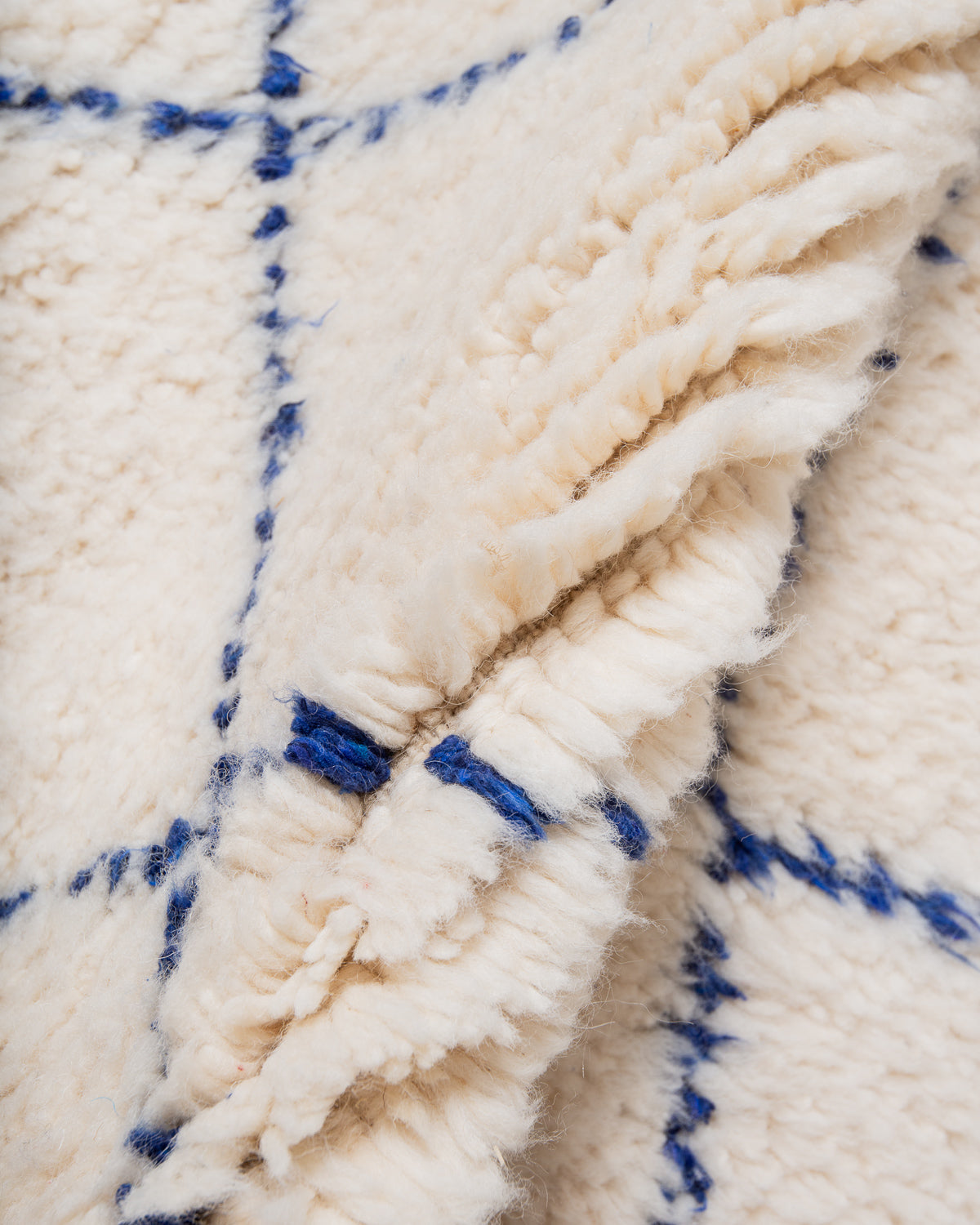 Modern, designer, handcrafted Berber rug from Morocco. Beniourain carpet with beautiful colours and patterns and fluffy wool texture.